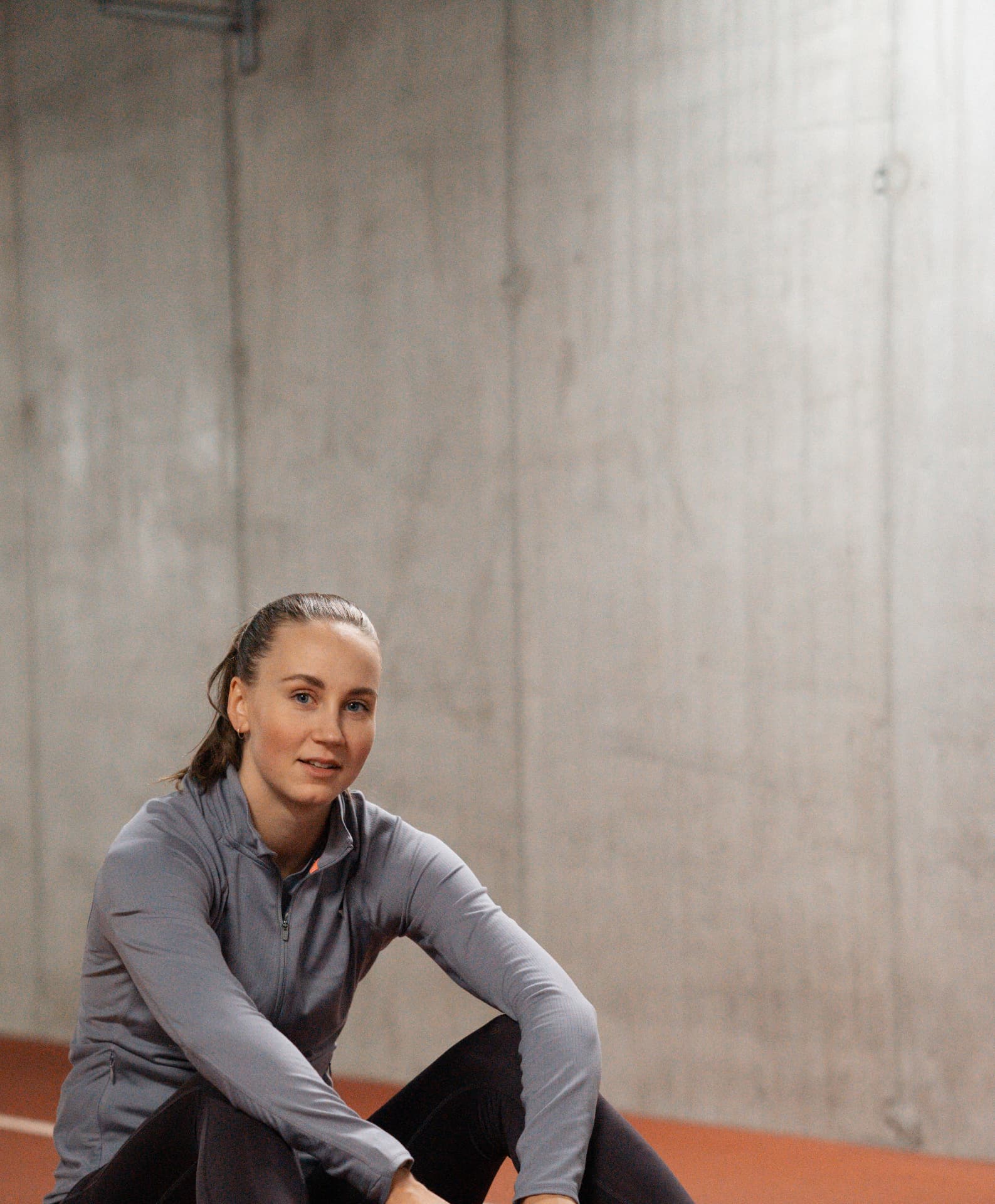 Viivi Lehikoinen in sportswear at an indoor training facility